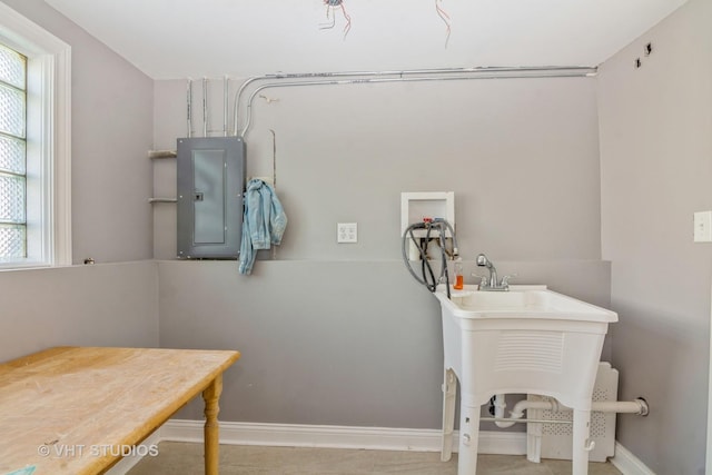 bathroom with electric panel, baseboards, and plenty of natural light