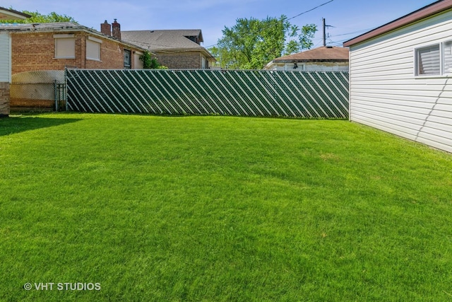 view of yard featuring a fenced backyard