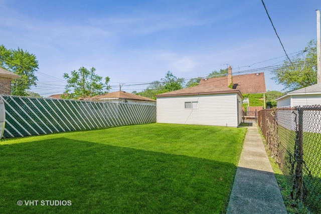 view of yard with a fenced backyard