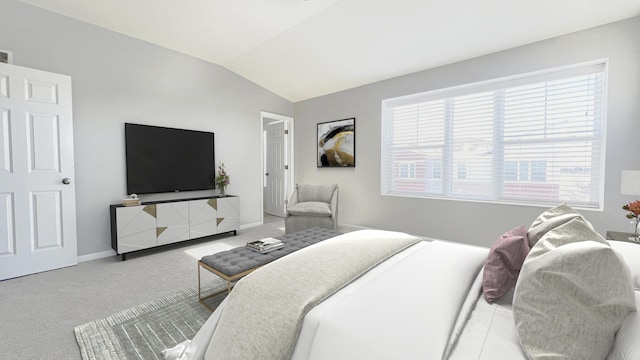 bedroom featuring carpet and lofted ceiling