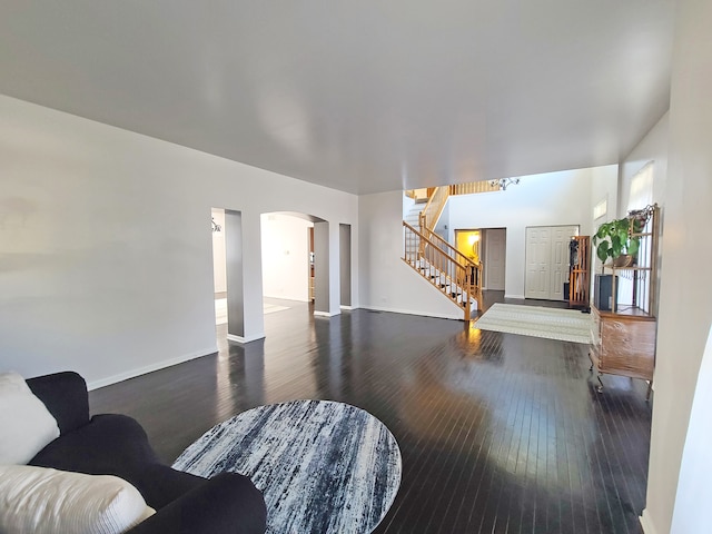 living room with dark hardwood / wood-style flooring