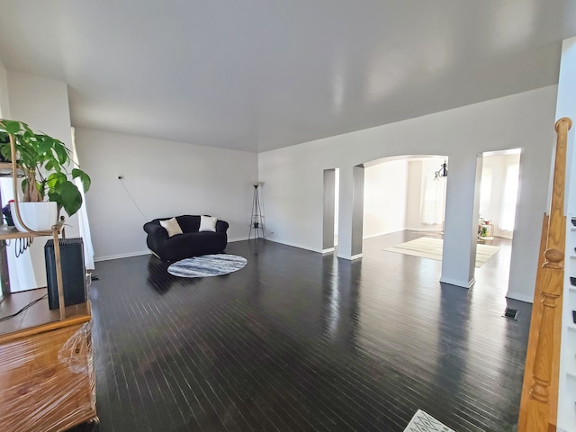 living room featuring dark wood-type flooring