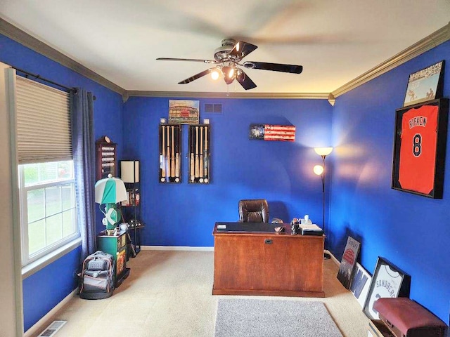 office featuring light colored carpet, ceiling fan, and crown molding