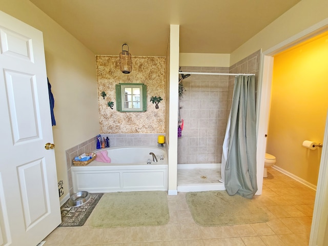 bathroom with tile patterned floors, toilet, and independent shower and bath