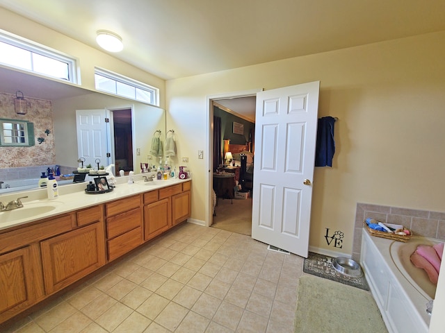 bathroom with vanity, tile patterned floors, and a bathing tub