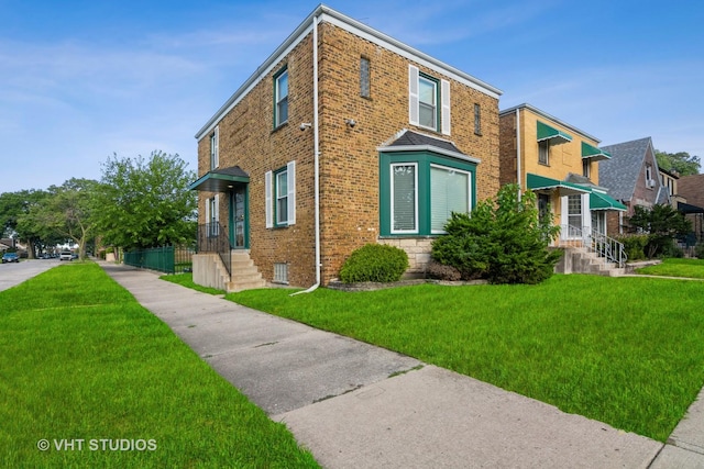 view of home's exterior featuring brick siding and a yard