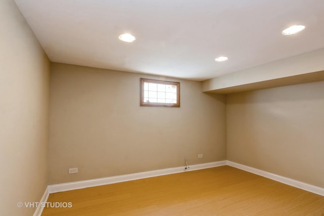 basement with recessed lighting, baseboards, and light wood-style flooring