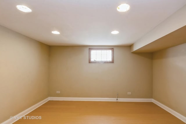 basement with light wood finished floors, recessed lighting, and baseboards