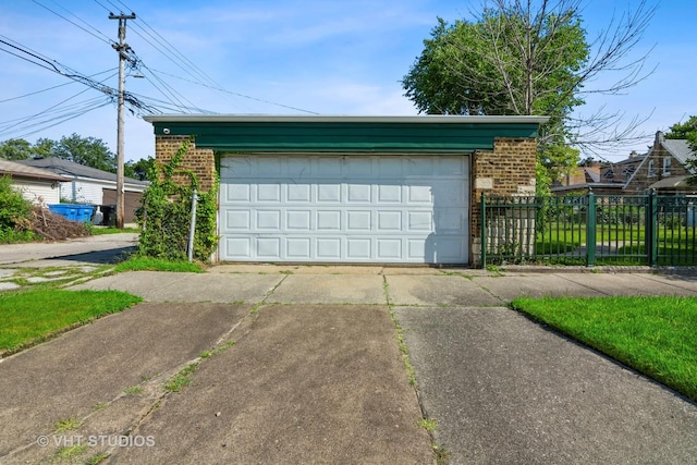 detached garage featuring fence