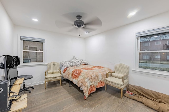 bedroom featuring hardwood / wood-style floors and ceiling fan