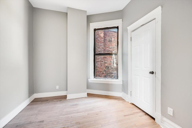 unfurnished room with light wood-type flooring