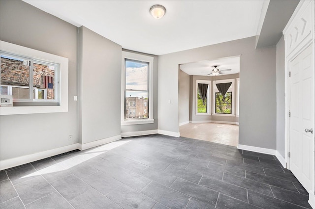 spare room with ceiling fan