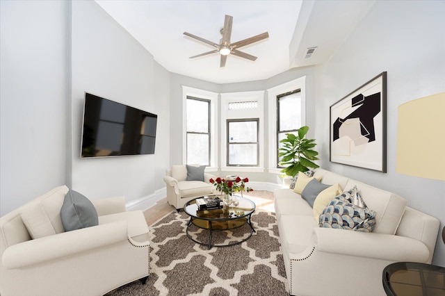 living room with hardwood / wood-style floors and ceiling fan