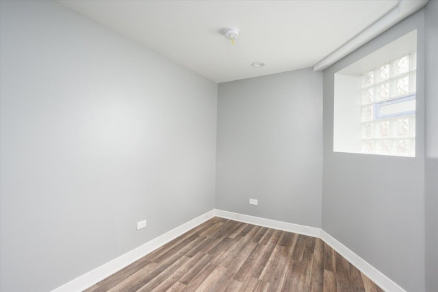 spare room with dark hardwood / wood-style floors