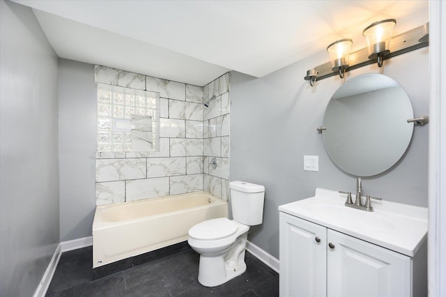 full bathroom featuring toilet, vanity, and tiled shower / bath