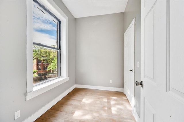 spare room featuring light wood-type flooring