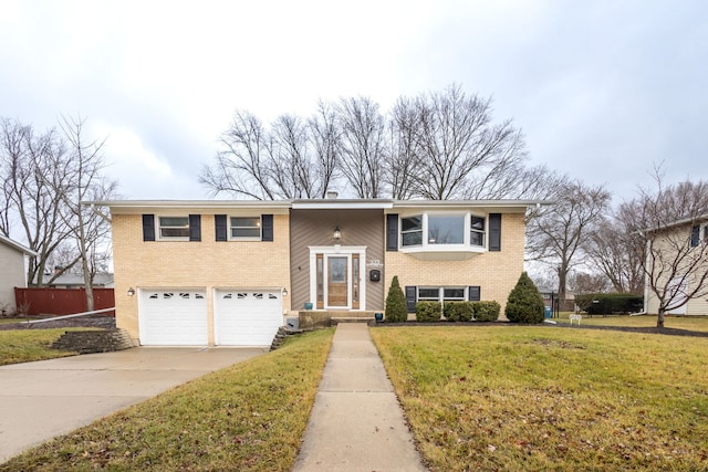 raised ranch with a garage and a front lawn