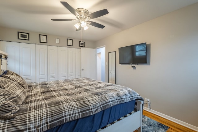 bedroom with hardwood / wood-style floors, ceiling fan, and a closet