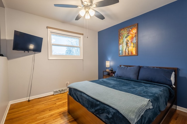 bedroom featuring ceiling fan and hardwood / wood-style floors