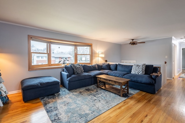 living room with ceiling fan, hardwood / wood-style floors, and ornamental molding