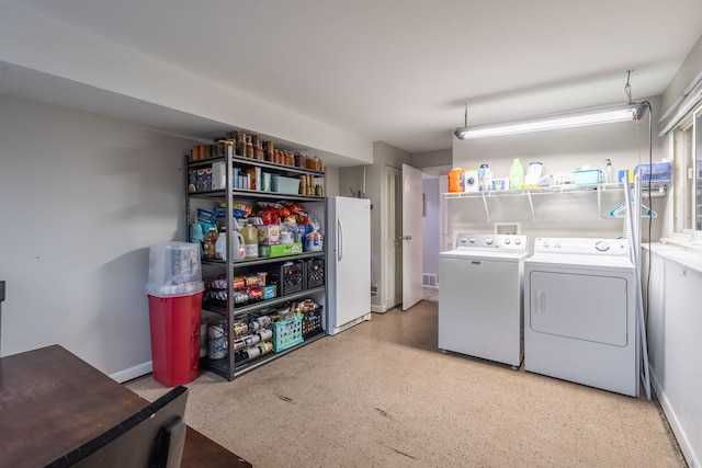 washroom with separate washer and dryer