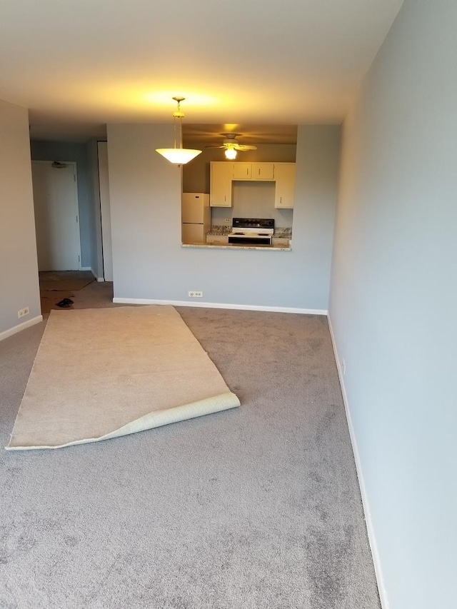 unfurnished living room featuring carpet floors