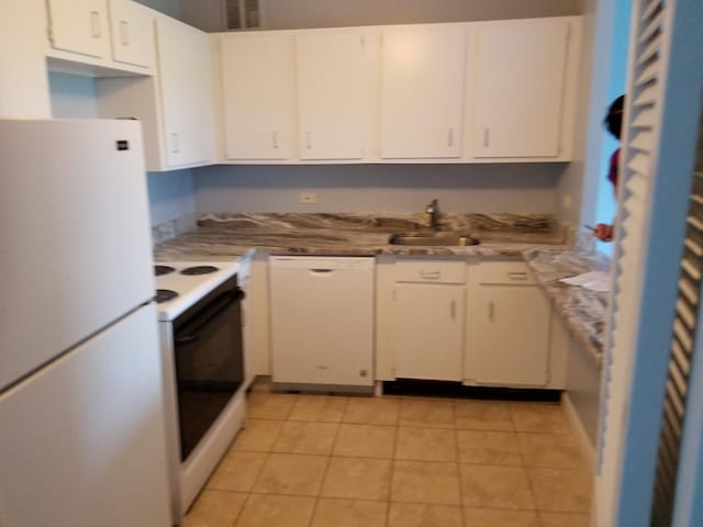 kitchen featuring white cabinetry, light tile patterned flooring, white appliances, and sink