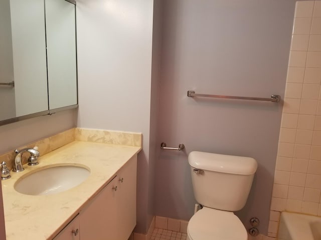 bathroom with tile patterned floors, vanity, and toilet