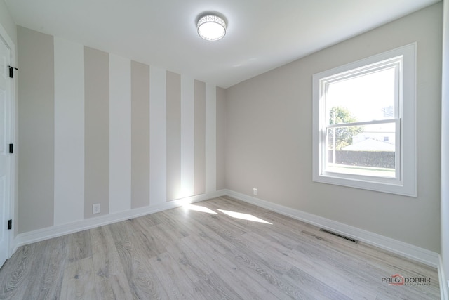 unfurnished room featuring light hardwood / wood-style floors