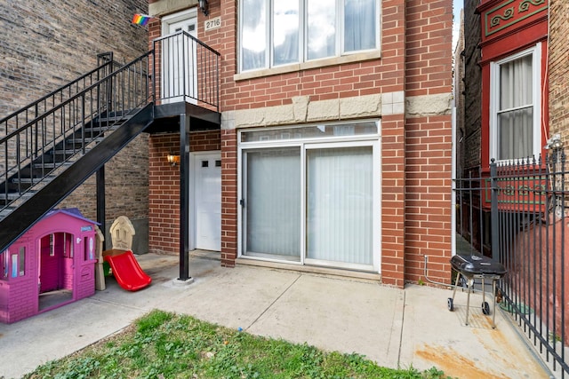 doorway to property with a patio area