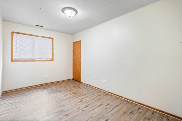 unfurnished room with light hardwood / wood-style flooring