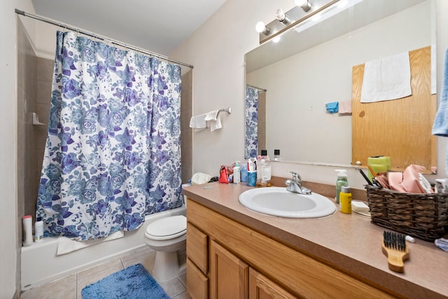 full bathroom featuring tile patterned floors, vanity, toilet, and shower / bath combo with shower curtain