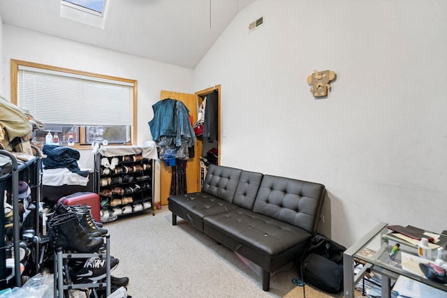 interior space with light colored carpet and lofted ceiling