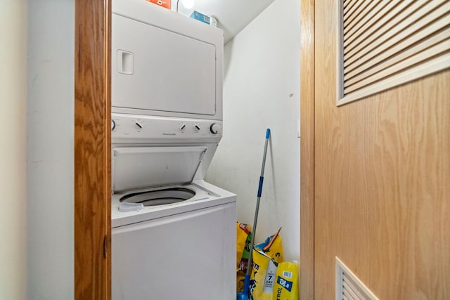 laundry area with stacked washer and clothes dryer