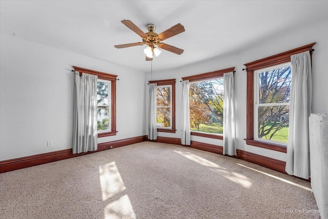 empty room with carpet floors and ceiling fan