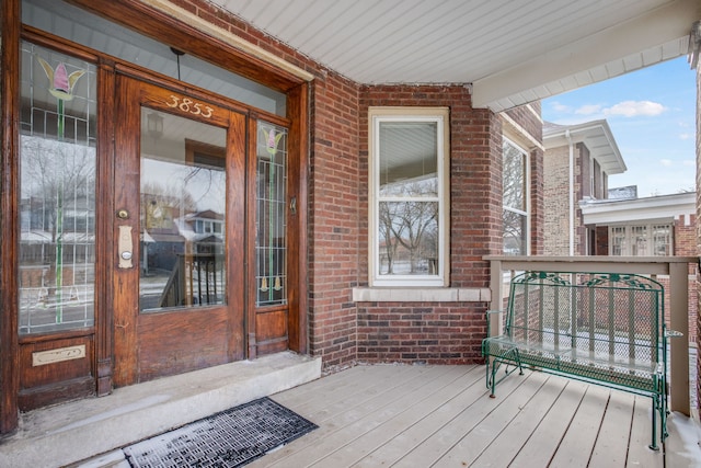 wooden terrace featuring a porch