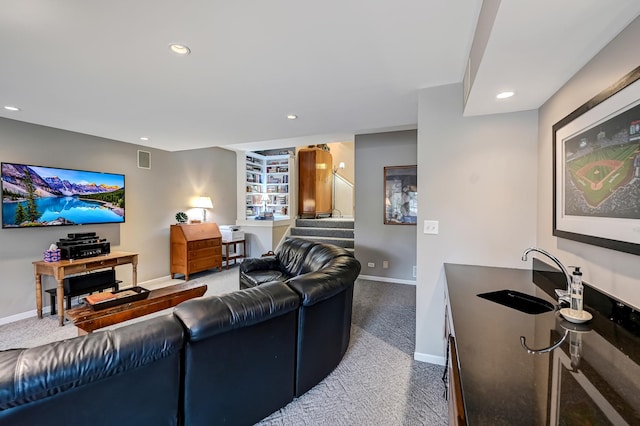 carpeted living room with built in features