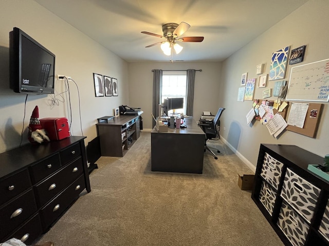 home office featuring ceiling fan and light carpet