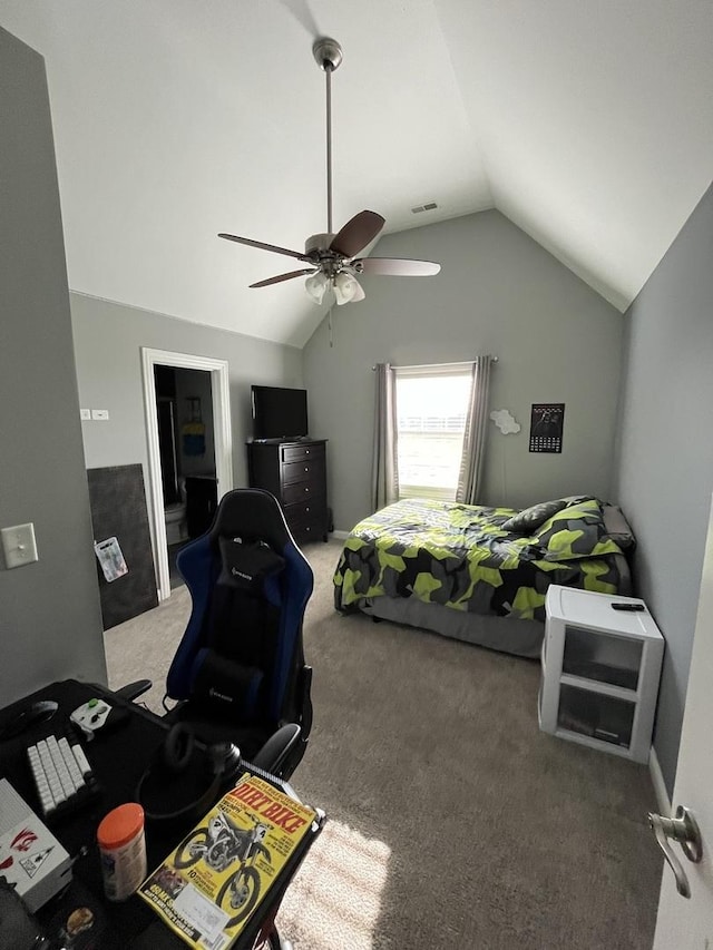 carpeted bedroom with ceiling fan and lofted ceiling