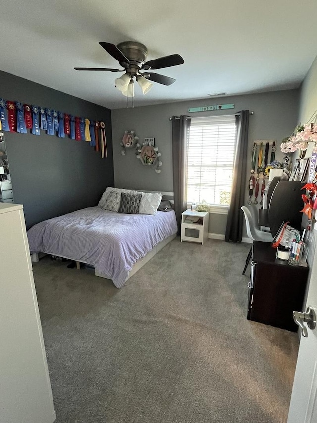 carpeted bedroom featuring ceiling fan