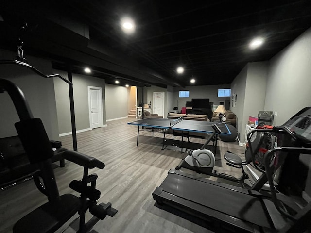 exercise area with light hardwood / wood-style floors