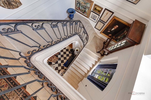 staircase featuring tile patterned floors