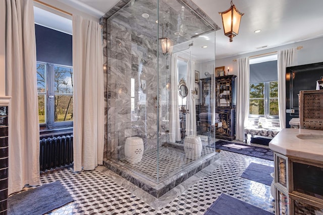 full bath featuring a stall shower, visible vents, radiator heating unit, vanity, and recessed lighting