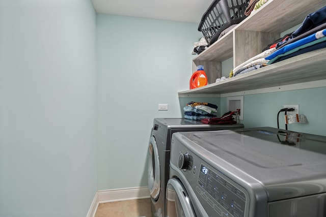 washroom with washer and clothes dryer