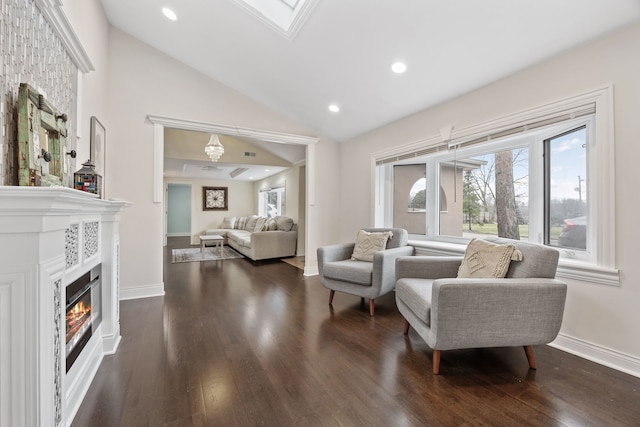 sitting room featuring dark hardwood / wood-style flooring and vaulted ceiling