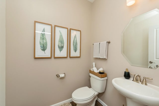 bathroom featuring sink and toilet