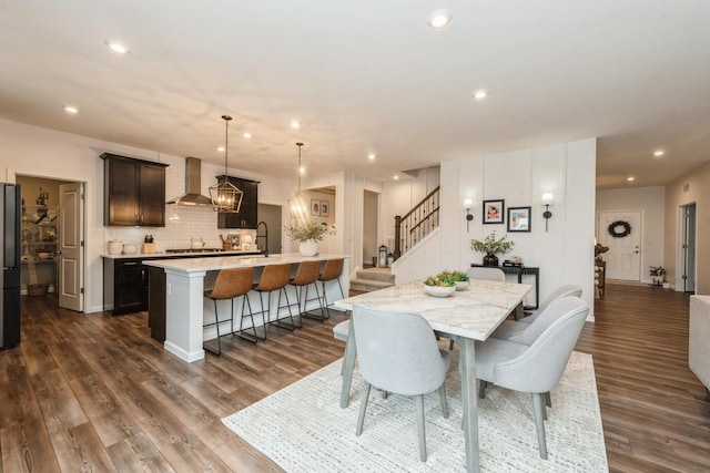 dining space with sink and dark hardwood / wood-style flooring