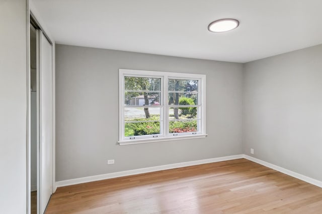 unfurnished bedroom with light wood-type flooring