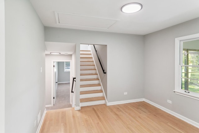 stairs featuring hardwood / wood-style flooring