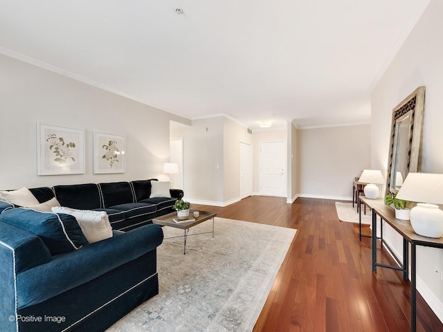 living room featuring hardwood / wood-style flooring and ornamental molding